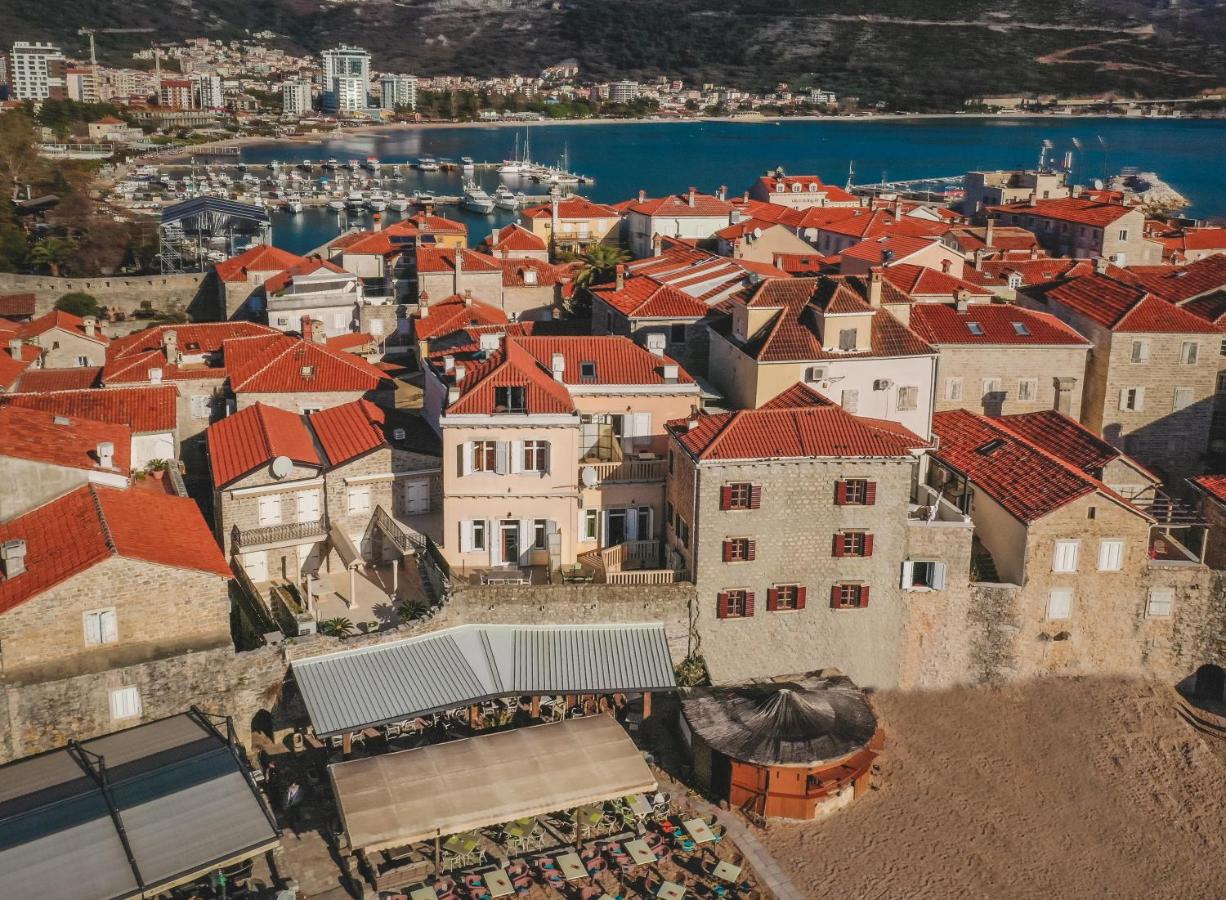 Aerial view of Budva Old Town's red rooftops beside the Adriatic Sea