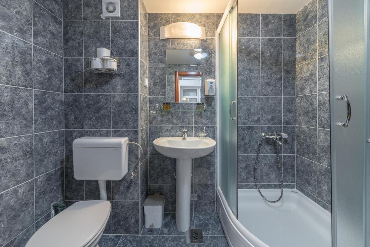 Bathroom with bath tub at R Club Apartments Old Town Budva