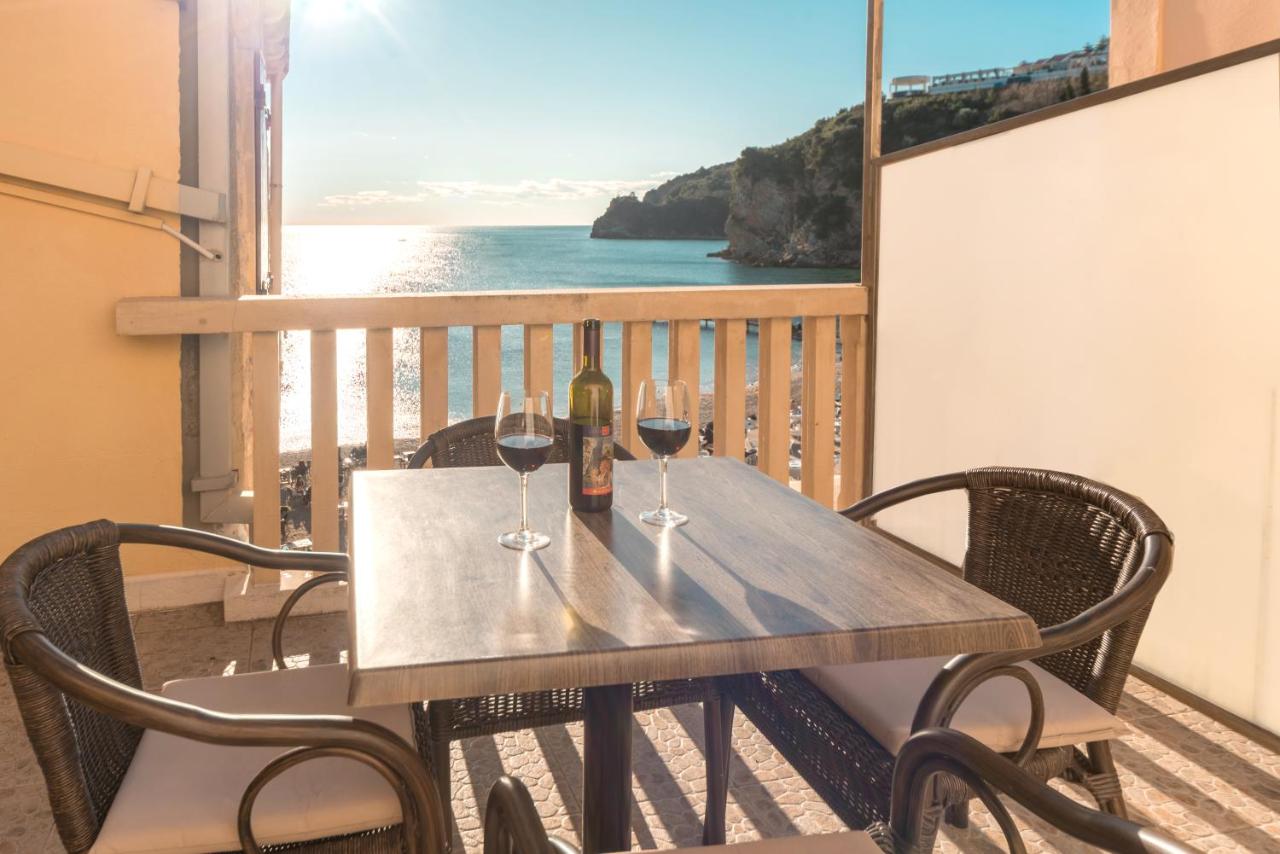 Terrace table set with wine glasses at R Club Apartments Old Town Budva