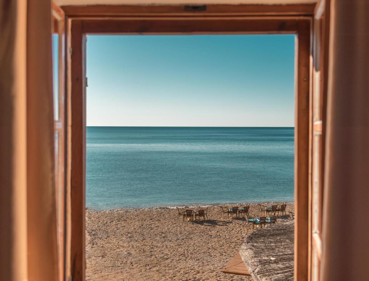 The Adriatic and Budva beach seen through an apartment window at R Club Apartments